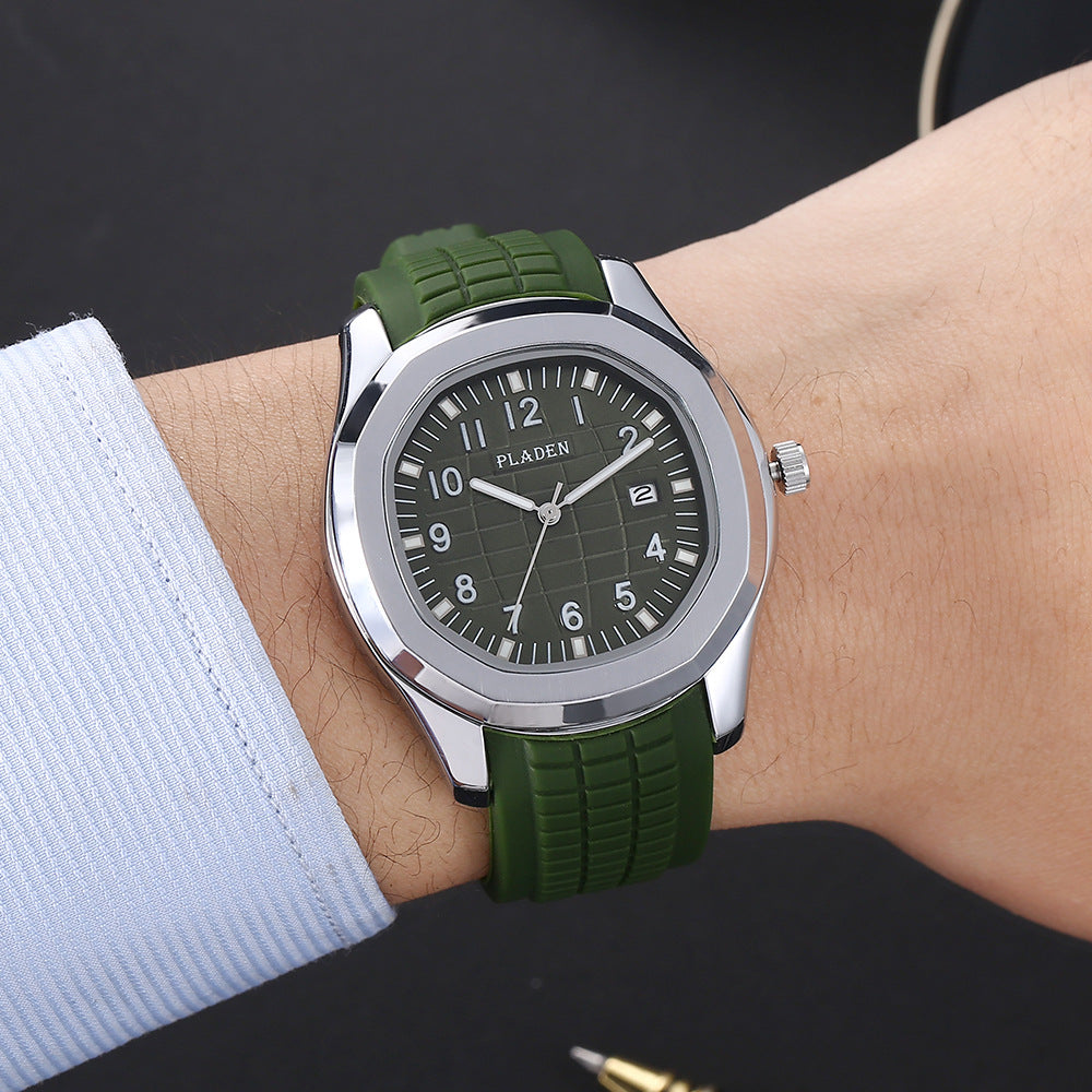 VEY 013 green sport watch worn on wrist — silver case, textured rubber strap, date window